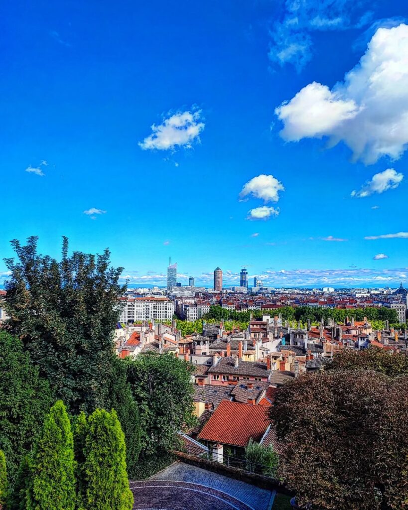 A panoramic view of Lyon from Fourvière Hill, with the Rhône and Saône Rivers winding through the city. Lyon Travel Guide and weed laws in France.