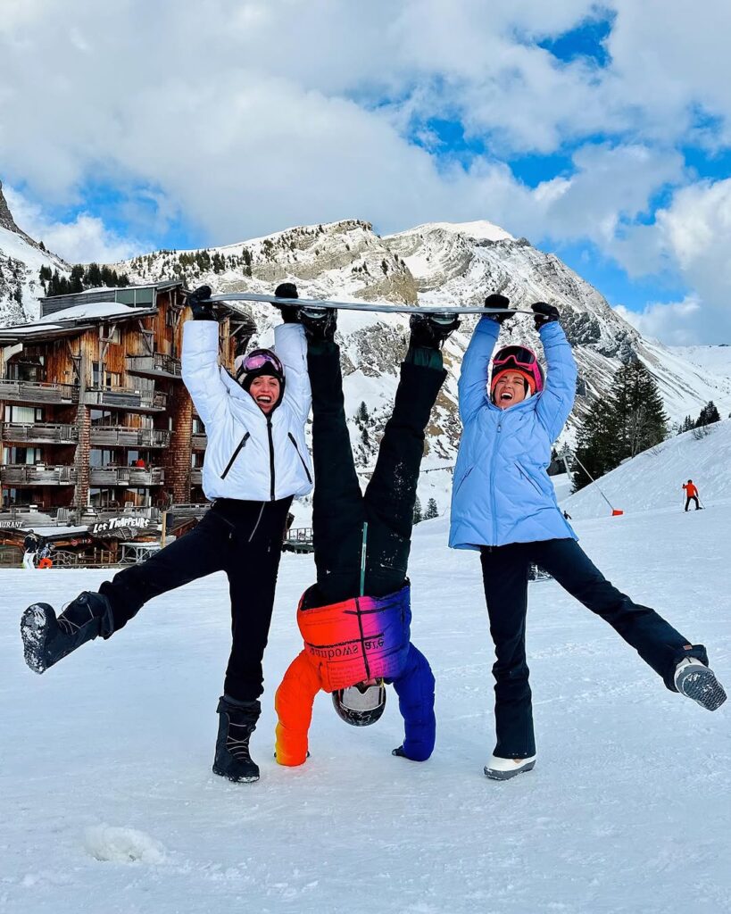 A view of Avoriaz’s unique architecture nestled in the mountains, with skiers enjoying the slopes.