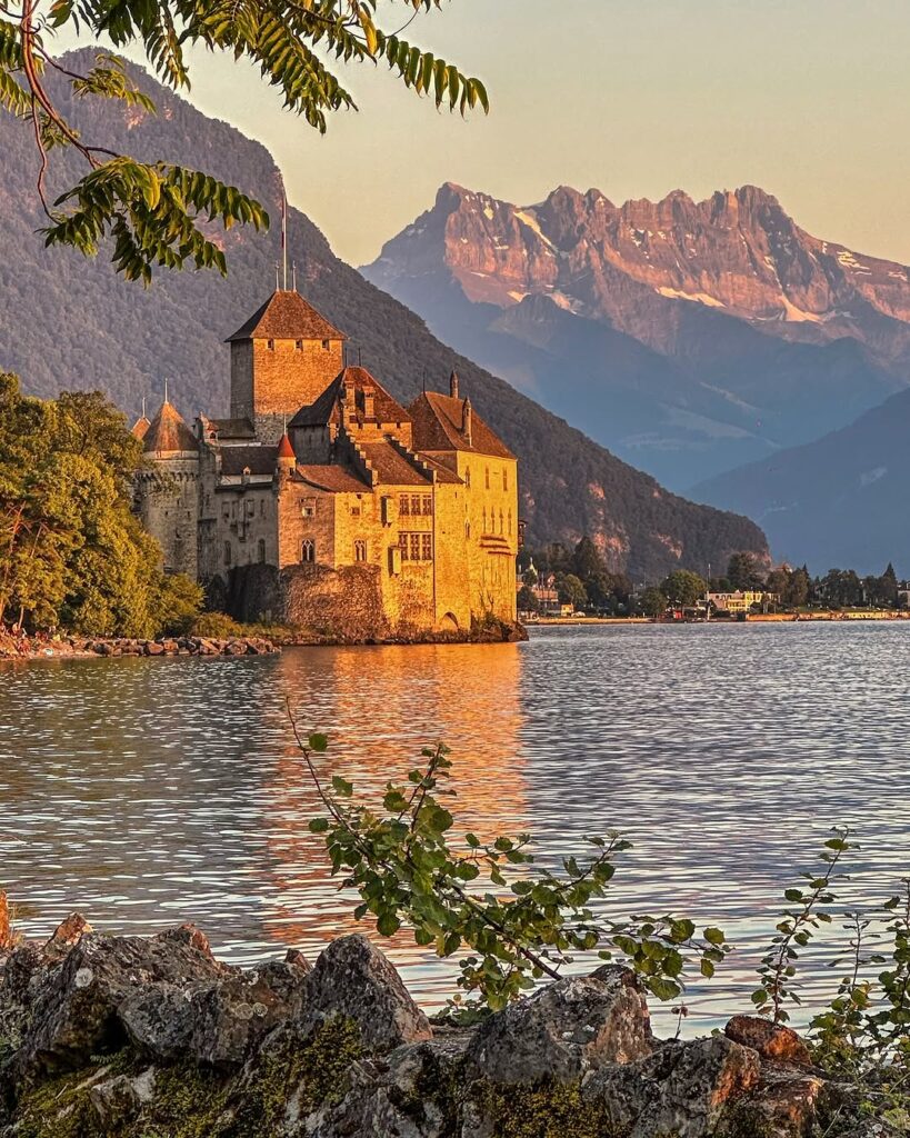 Château de Chillon, reflected in the serene waters of Lake Geneva.