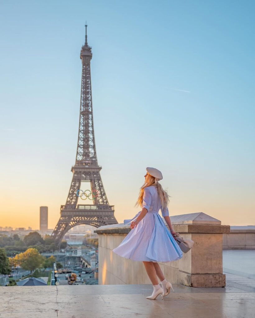 A picturesque shot of the Eiffel Tower at sunset, with the Seine River in the foreground. Paris Travel Guide and Weed Laws.