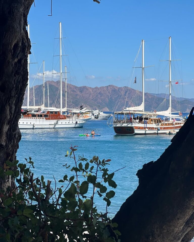 Sunset over Marmaris Marina with yachts and reflections